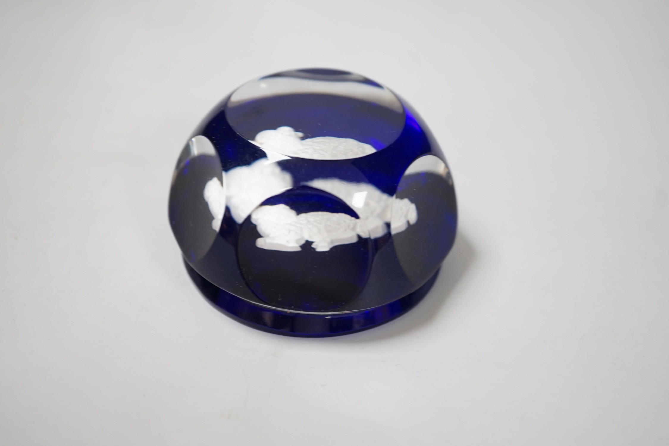A Baccarat decanter and a Baccarat sulphide paperweight. Tallest 24cm